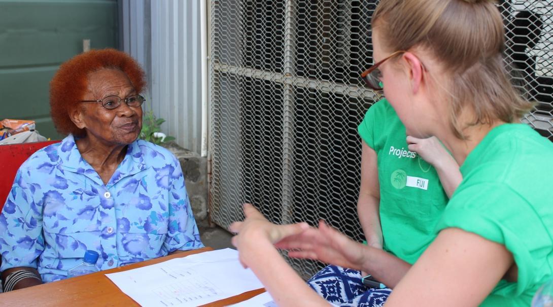 A female Projects Abroad intern is talking to a local elderly lady about her medical experience whilst completing her nutritional internship in Fiji. A young intern is pictured with an elderly local lady discussing her medical experience whilst she is on her nutritional internship in Fiji with Projects Abroad.